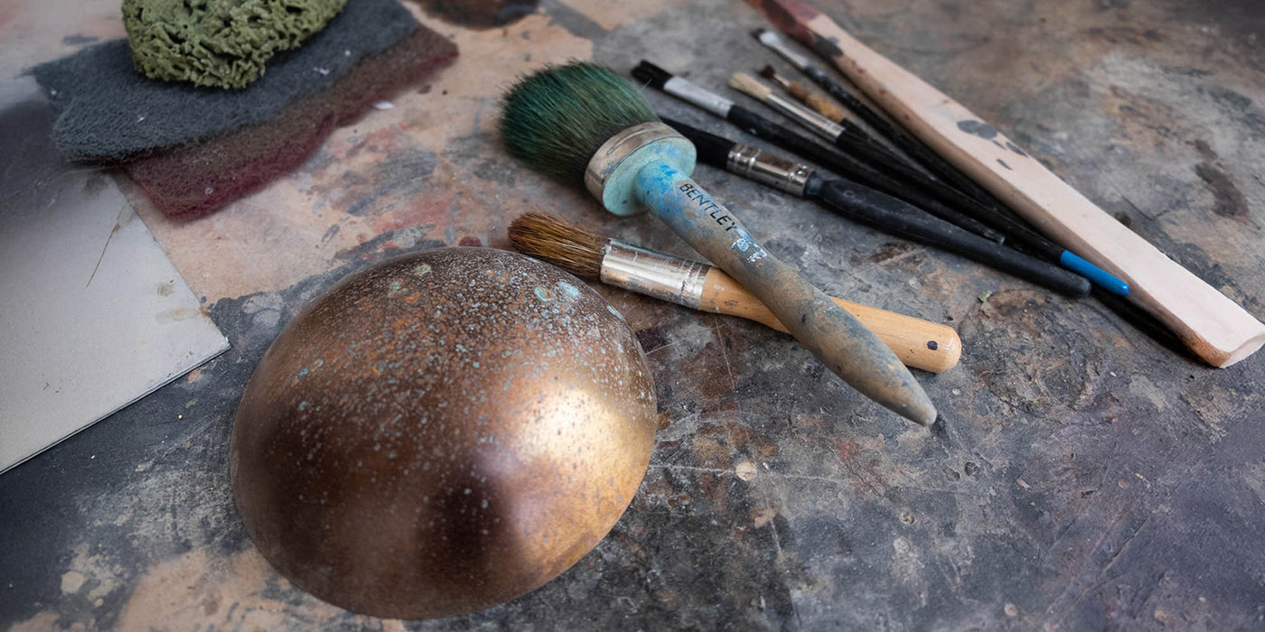 Metal object and brushes on a textured surface - Image 5